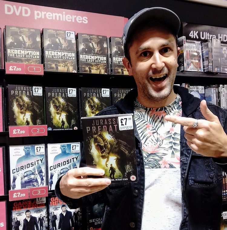 Nathan Head with a Jurassic Predator DVD at number 2 in the HMV charts in their Chester branch